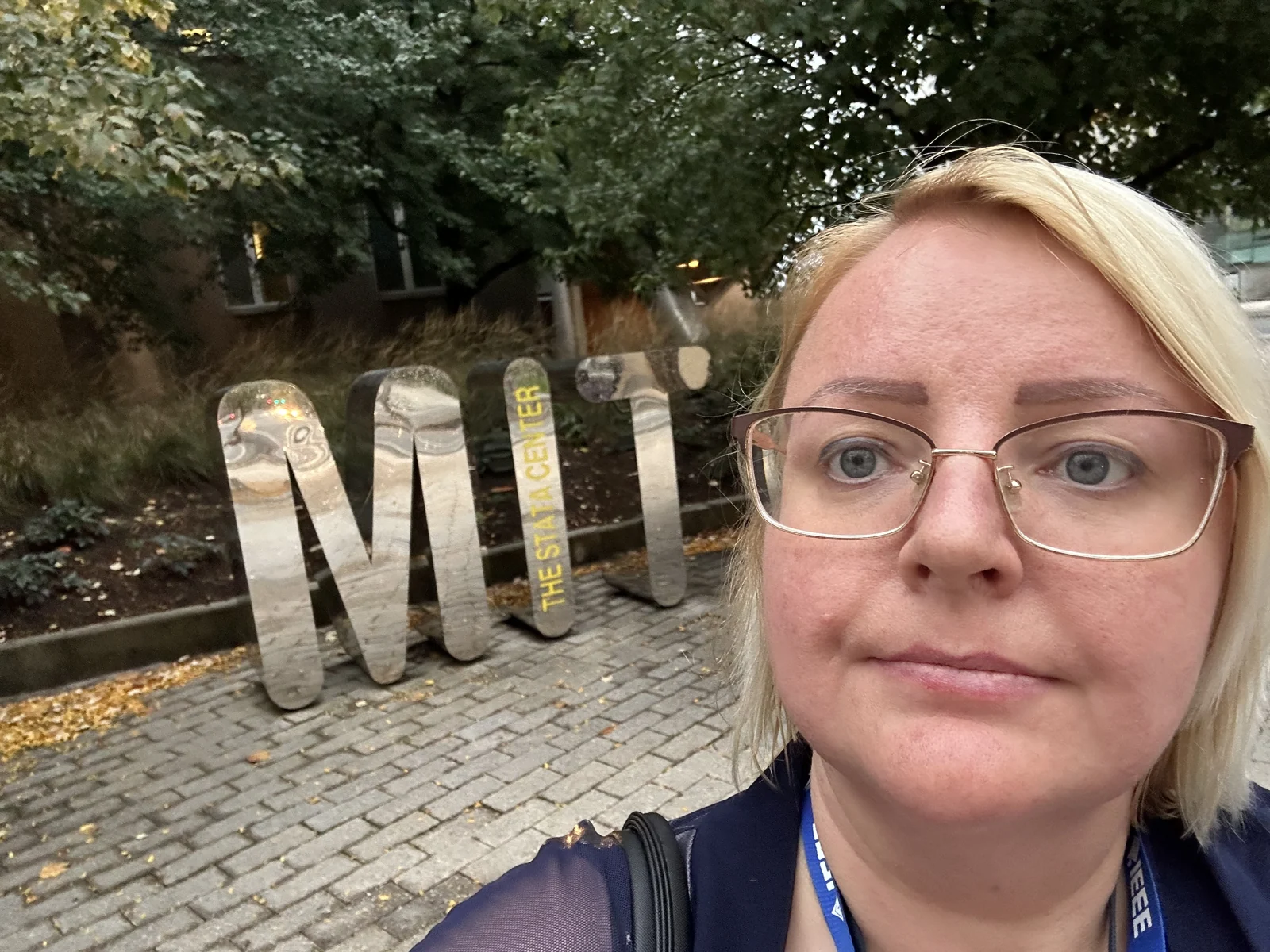 Julie beside the MIT Stata Center sign outdoors